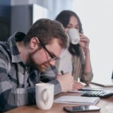 Family reviewing college funding options — free money for college scholarships