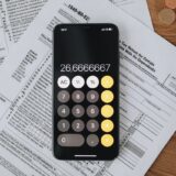 Calculator and retirement documents representing updated 2026 401k contribution limits