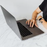 IRS tax filing processing and refund delays concept with computer and documents